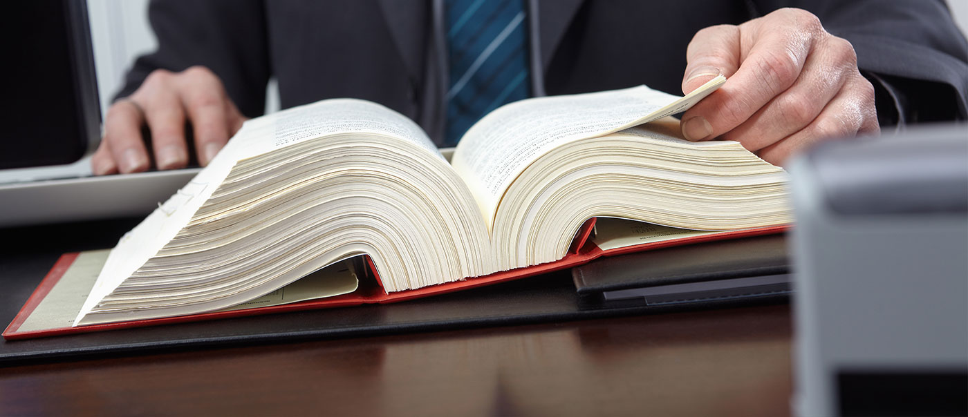 Lawyer reads book.