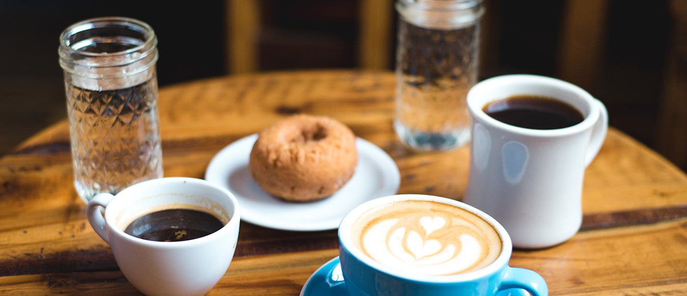 table with coffee and donut