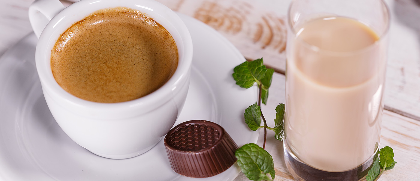 coffee cup next to chocolate