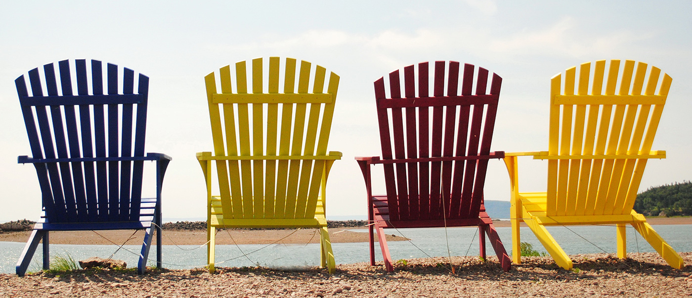 adirondack chairs on lake edge