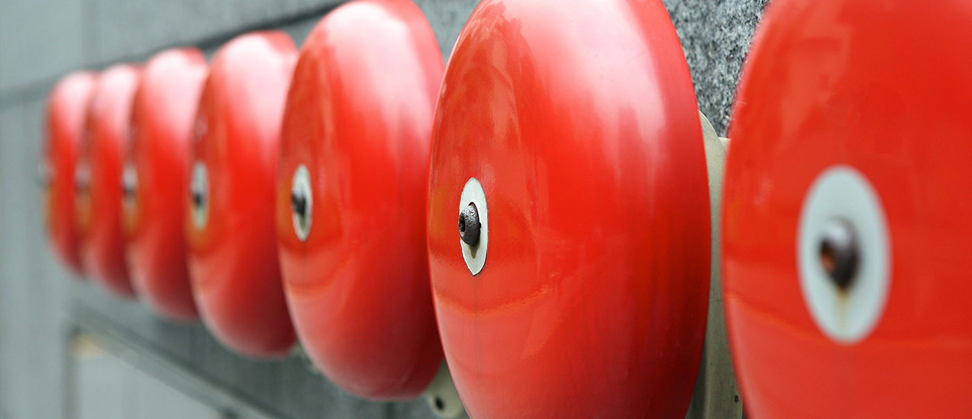 Row of fire alarm bells