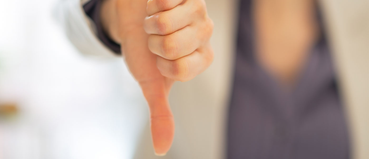 Woman giving "thumbs down"