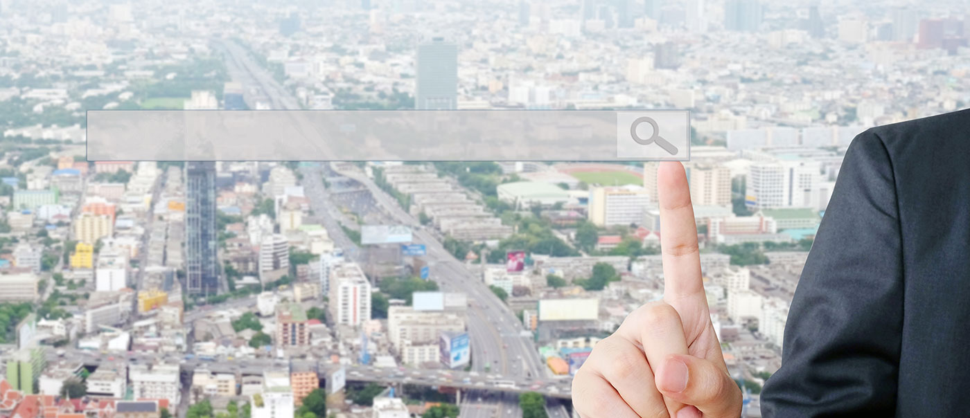 Search bar over aerial view of residential area