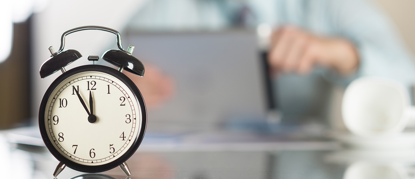 A clock on a desk.