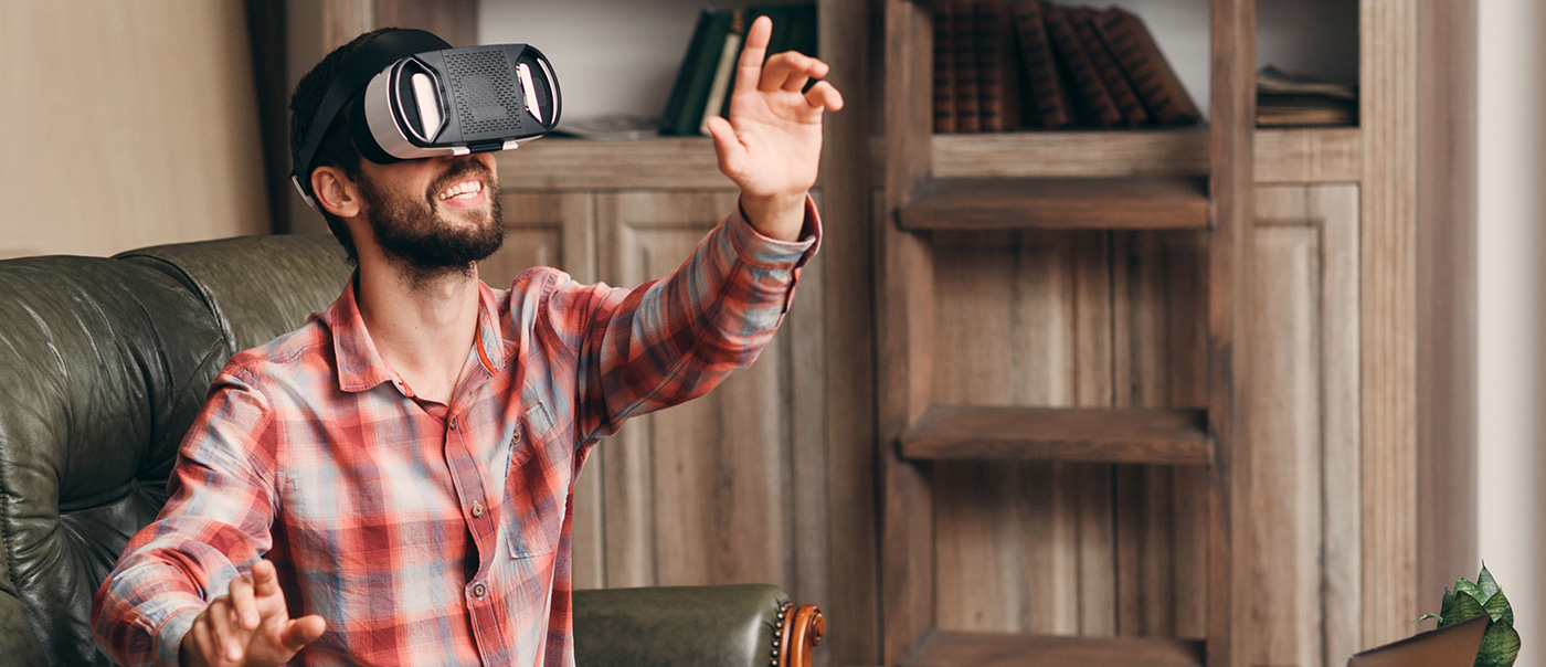 Man uses VR headset.