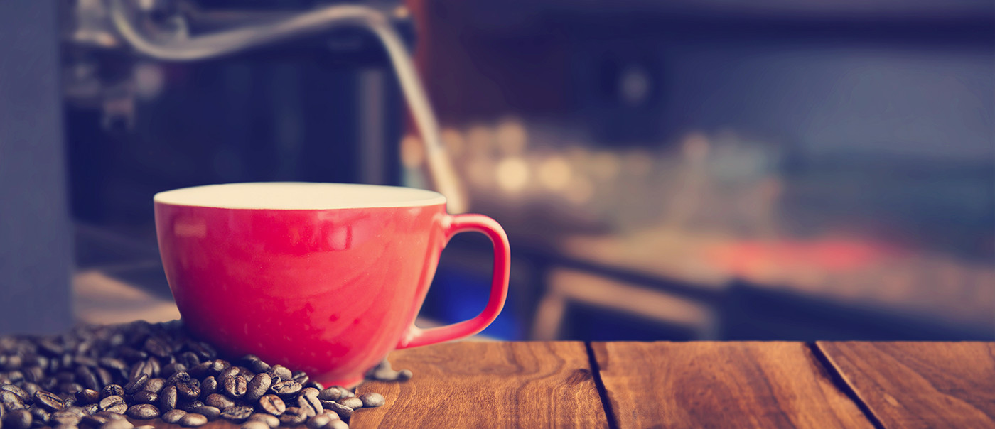 Coffee cup on table.