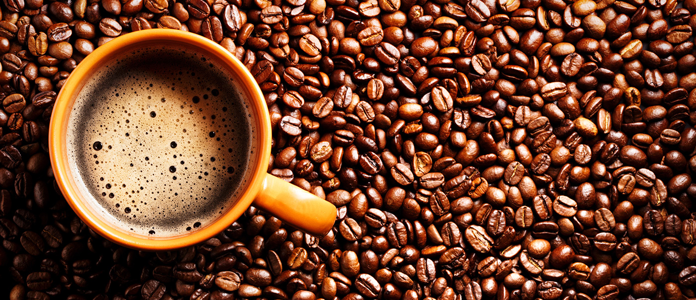 Coffee cups on top of beans.