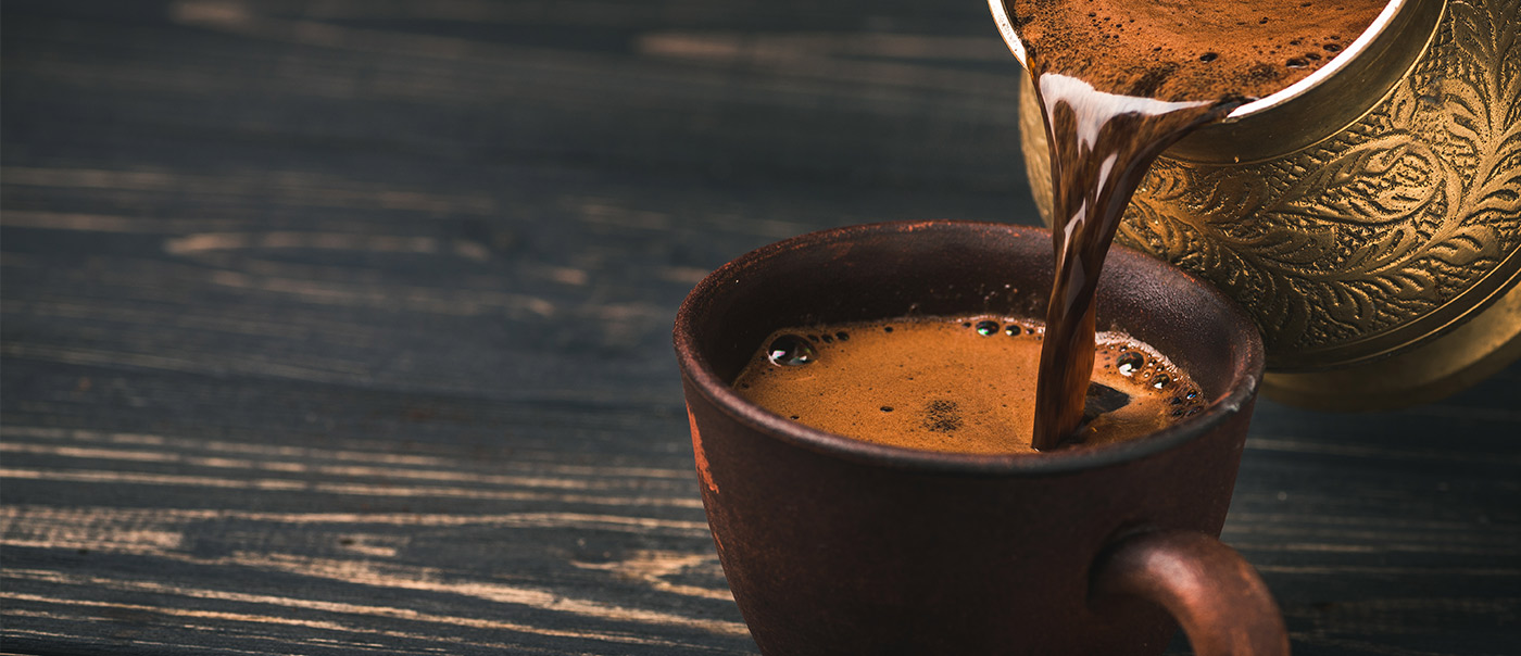 Coffee pouring into pot.