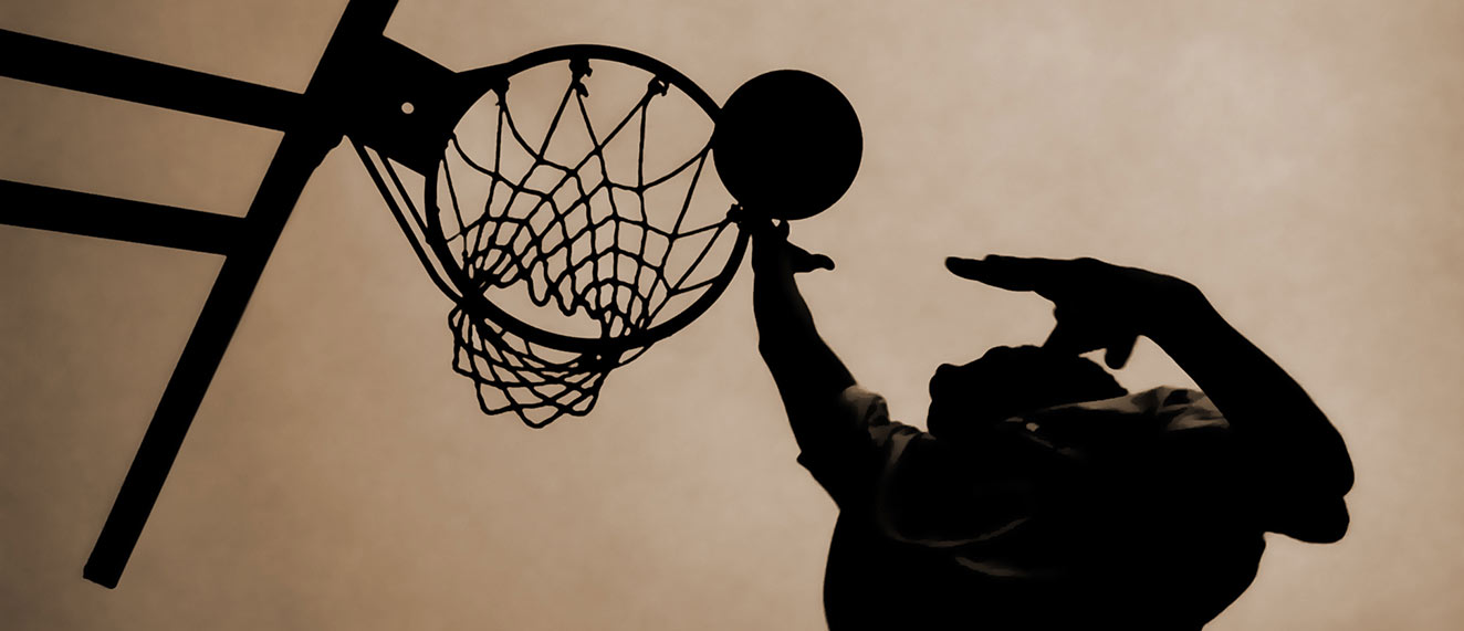 Person dunking basketball