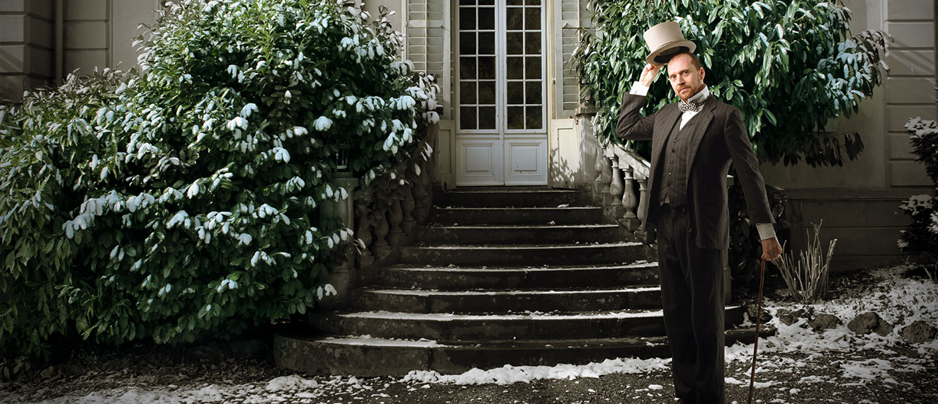 Daper man standing in front of estate