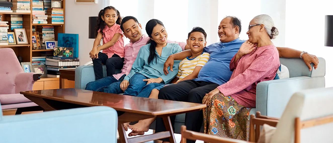 Multigenerational family sitting on couch.