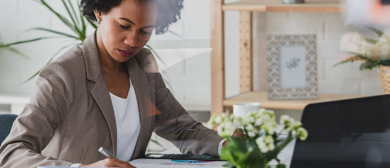 Woman planning at desk.