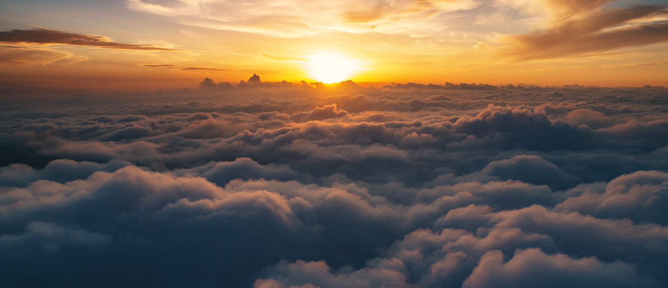 Sunrise over clouds