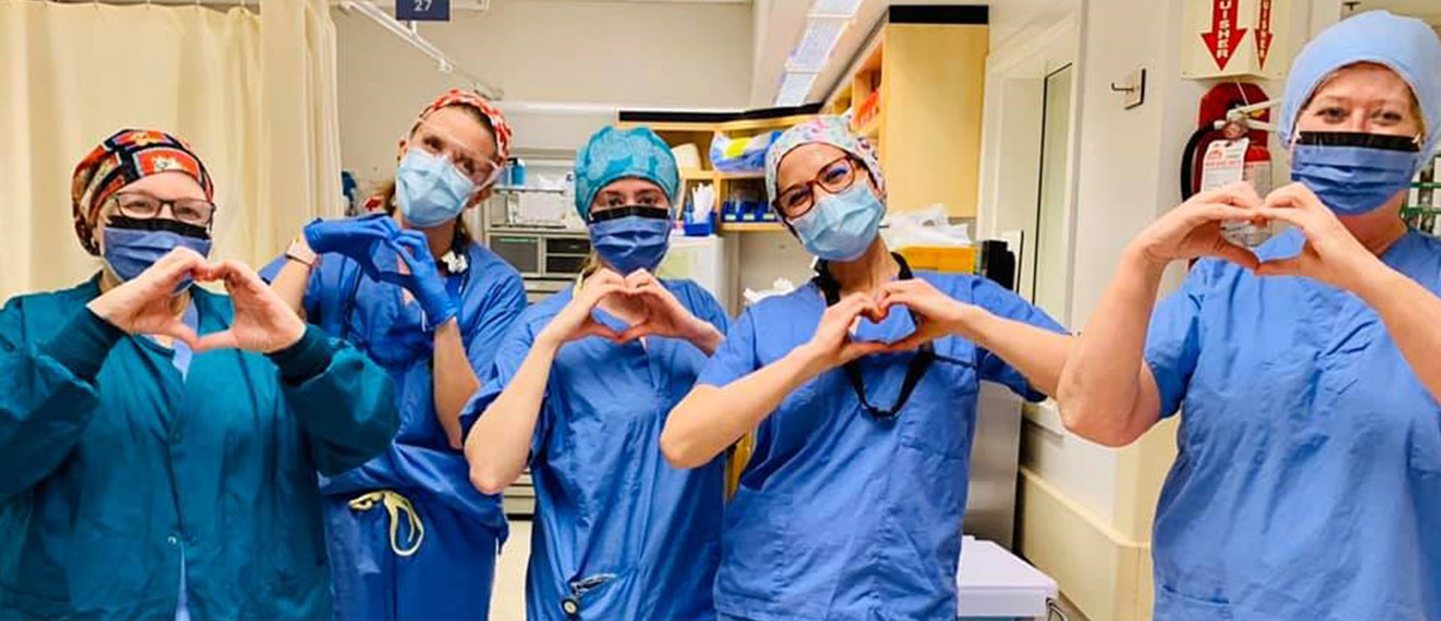 Nurses making hearts with hands