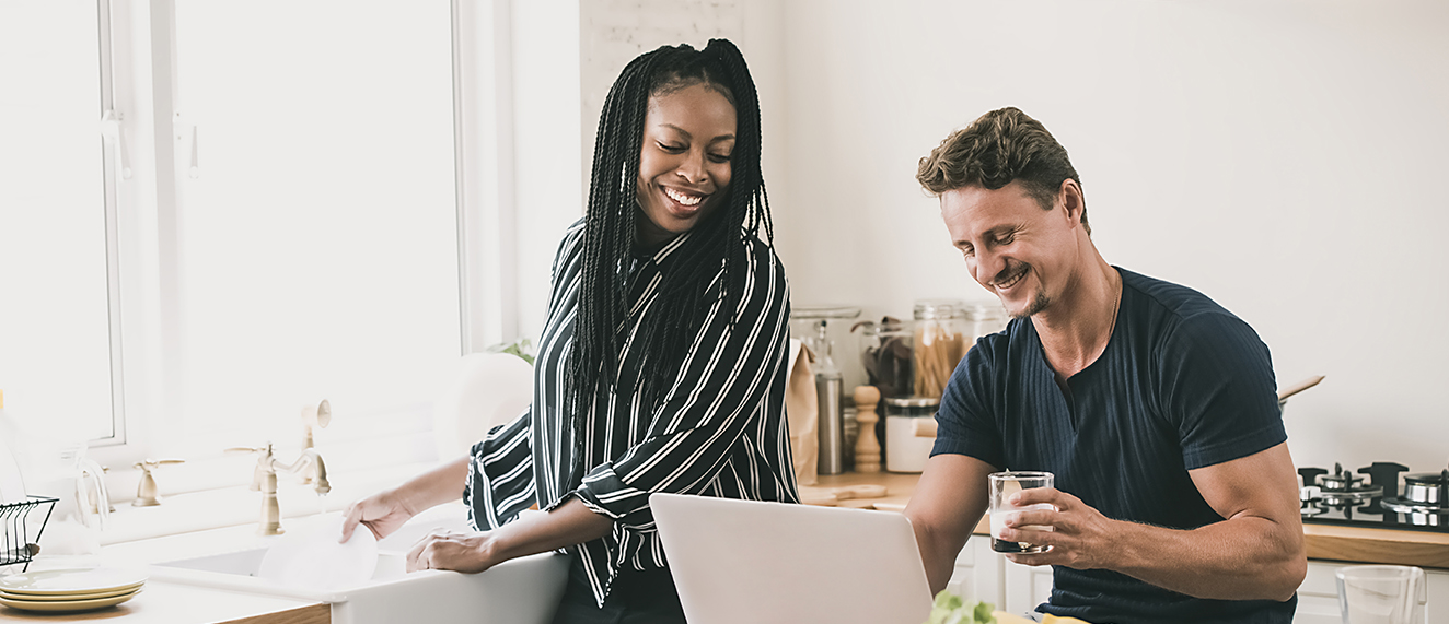 Man and woman looking on computer. 