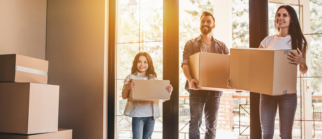 Happy family moving in to new house.