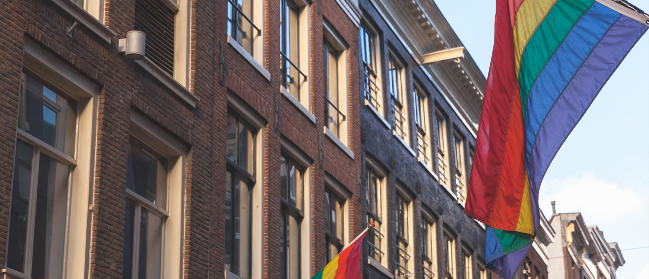 Pride flag on building.