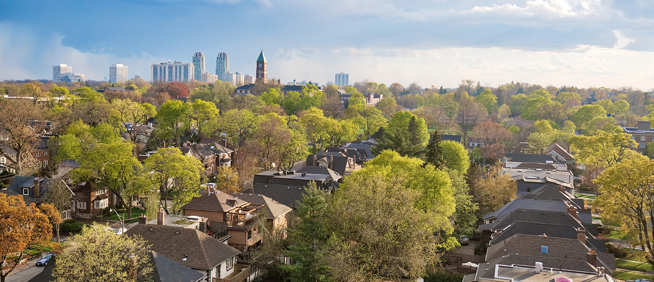 view of houses with city in the background