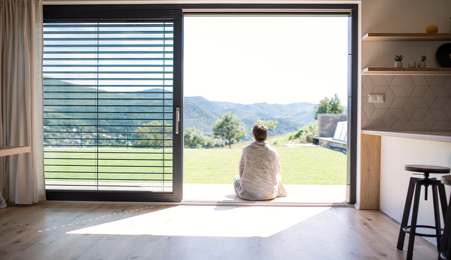 Woman sitting in country house