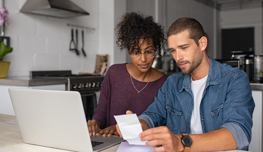 Young couple working on budget