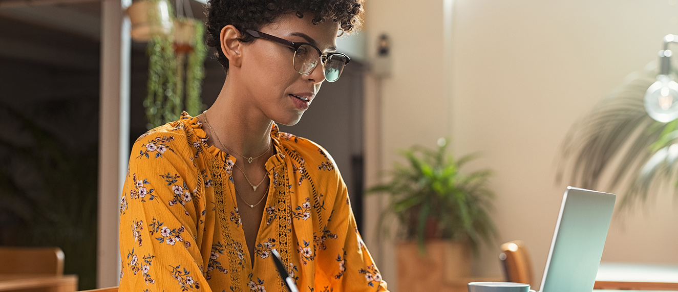 Woman working on Learning Hub.