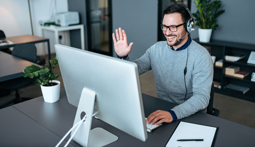 Man talking to computer screen.