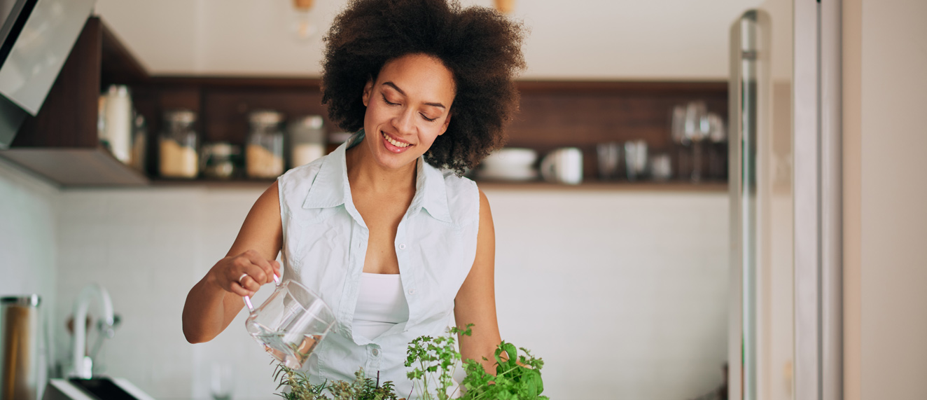 Woman planting herb garden