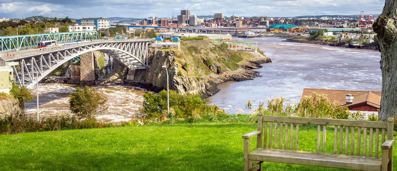 New Brunswick skyline along water.