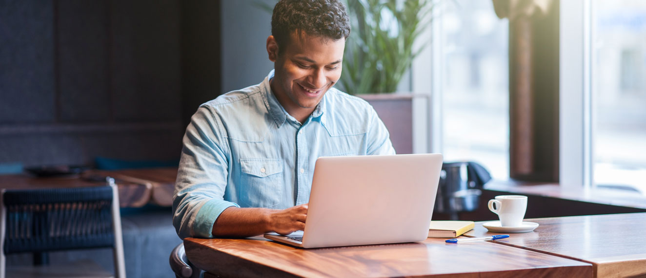 Man blogging at a table