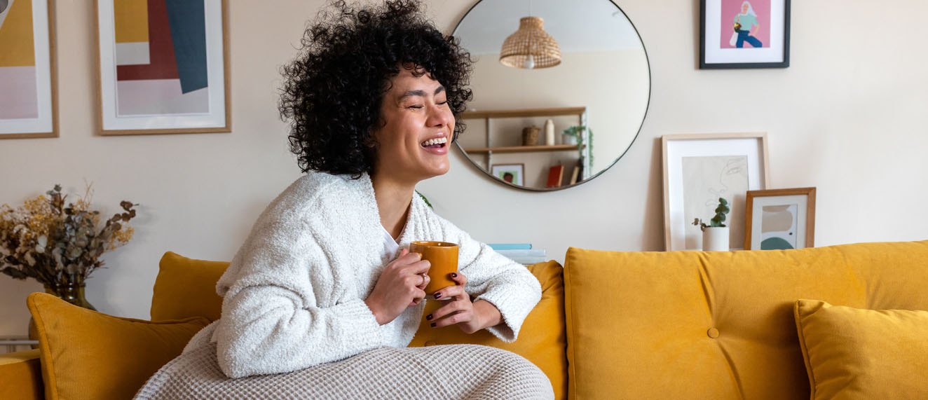 Woman sitting on cozy couch.