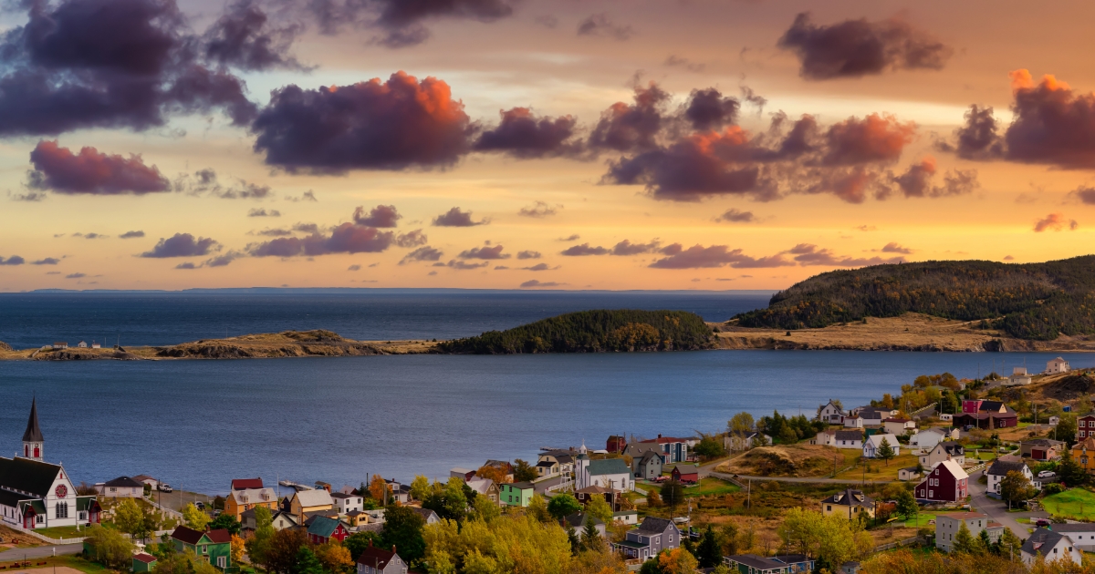 Landscape view of waterfront community at sunset.