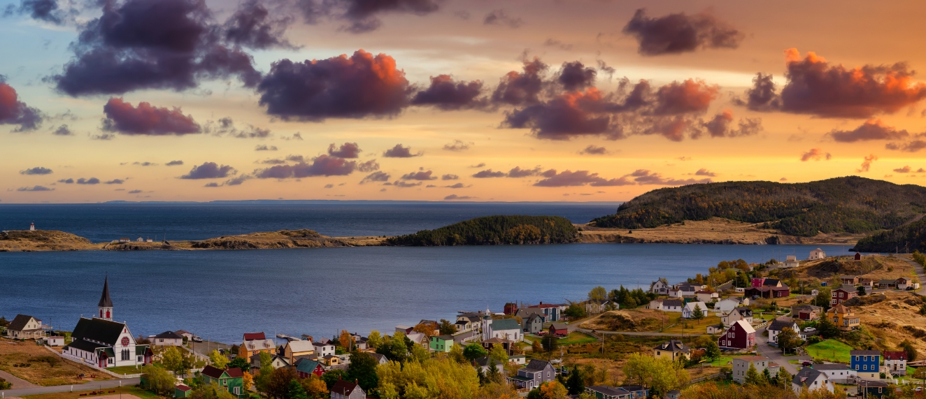 Landscape view of waterfront community at sunset.