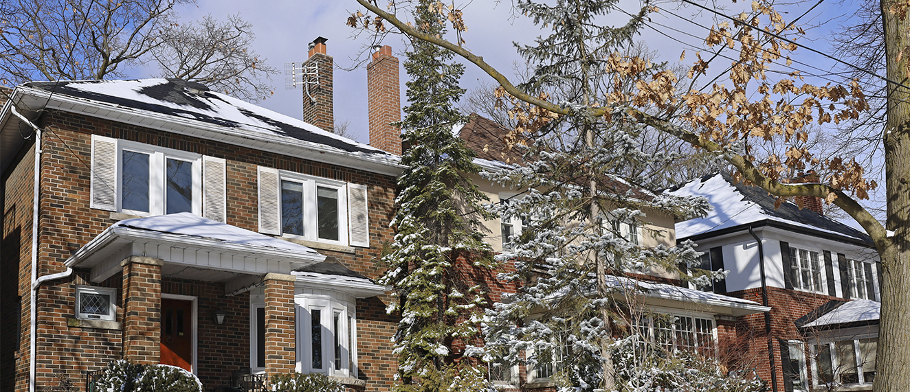 Street of traditional middle class single family houses on a sunny day in winter