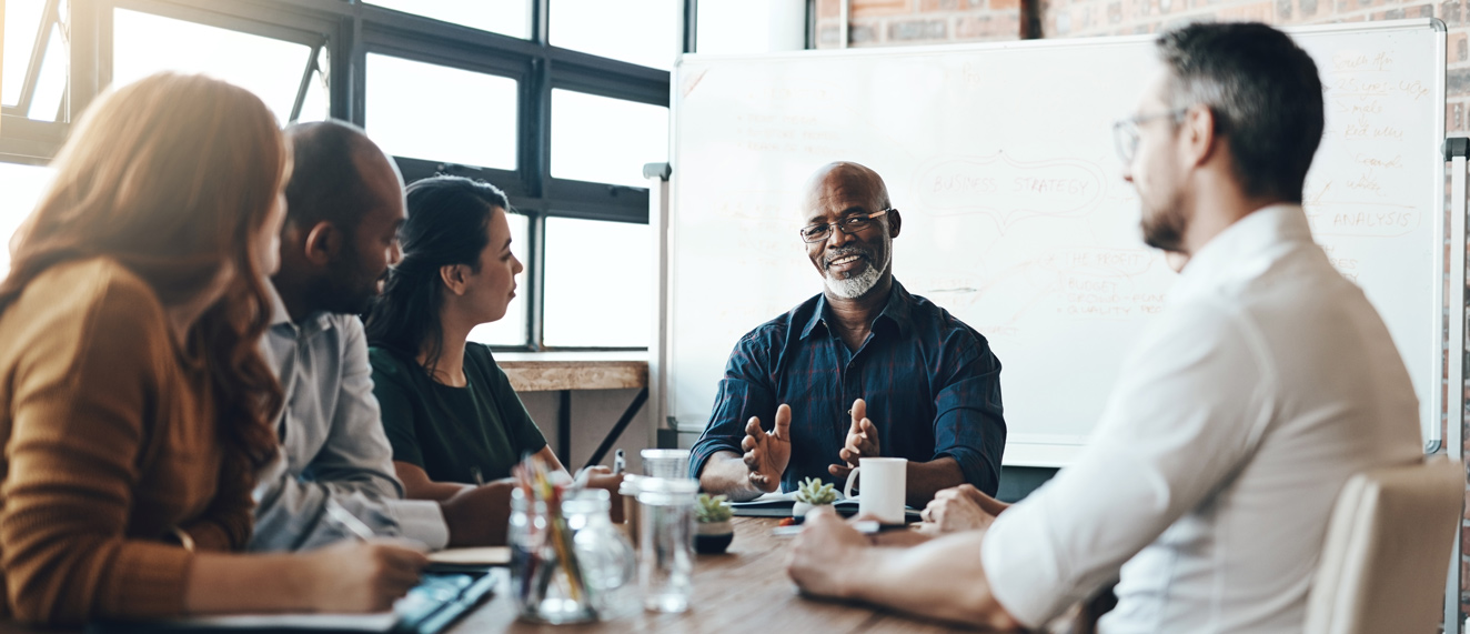 colleagues meeting in a board room.