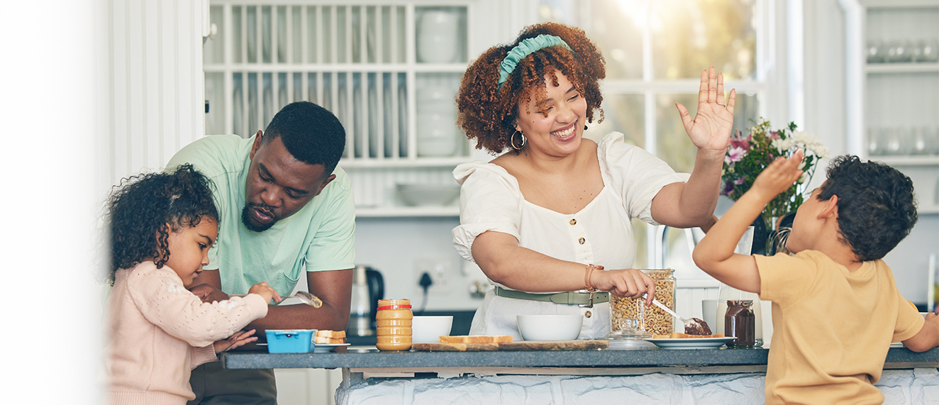 Love, morning breakfast food and black family children, mother and father eating meal, bonding and prepare ingredients. High five, home kitchen or hungry mom, dad and young youth kids happy for lunch.