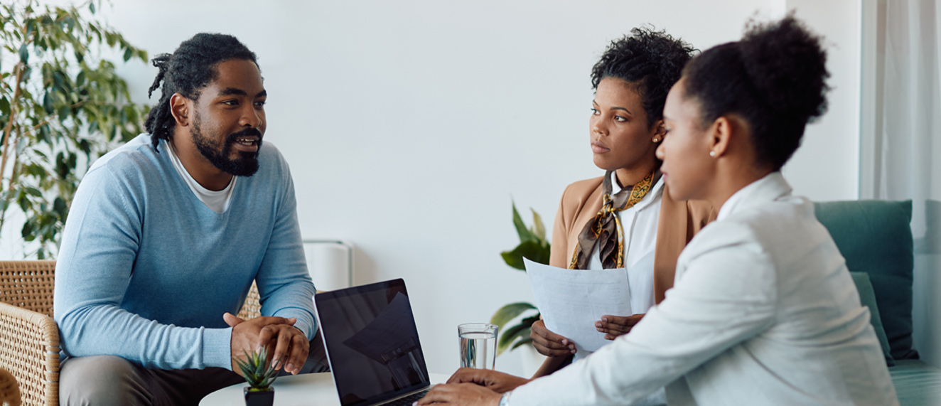 Couple talking to REALTOR®.