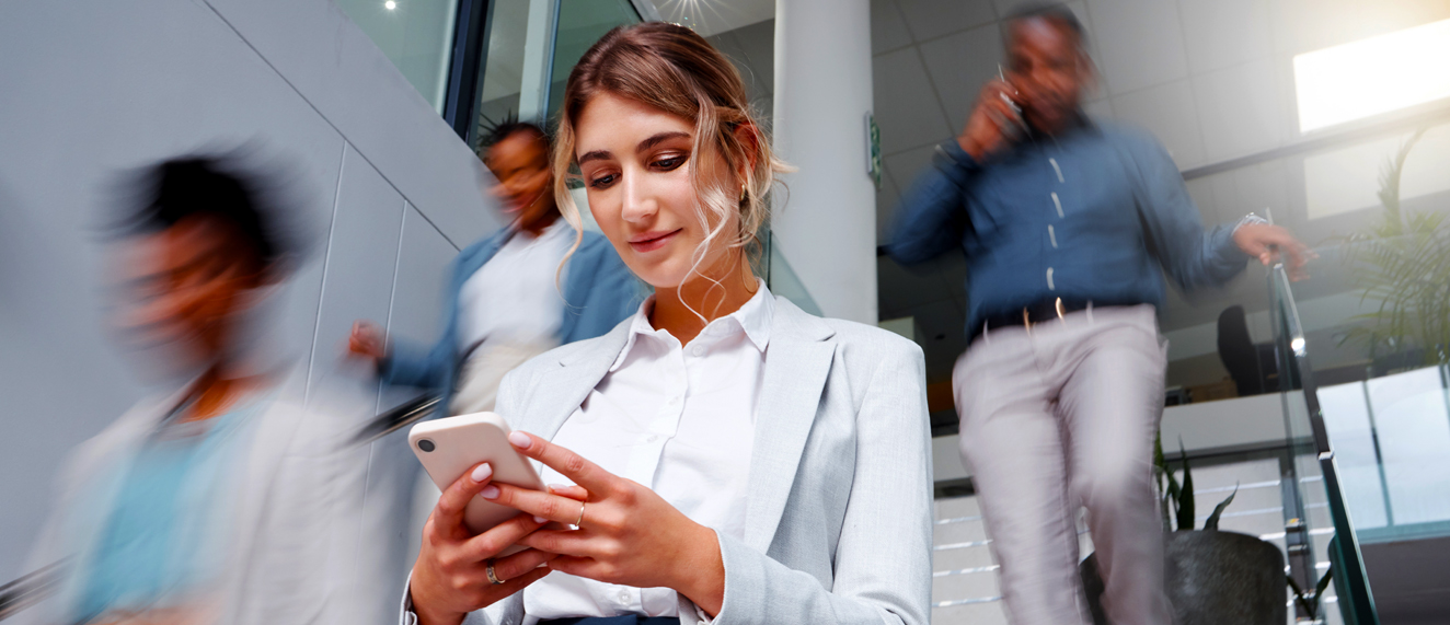 Business woman looking at her phone.