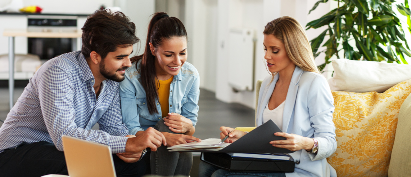 Real estate agent with two clients.