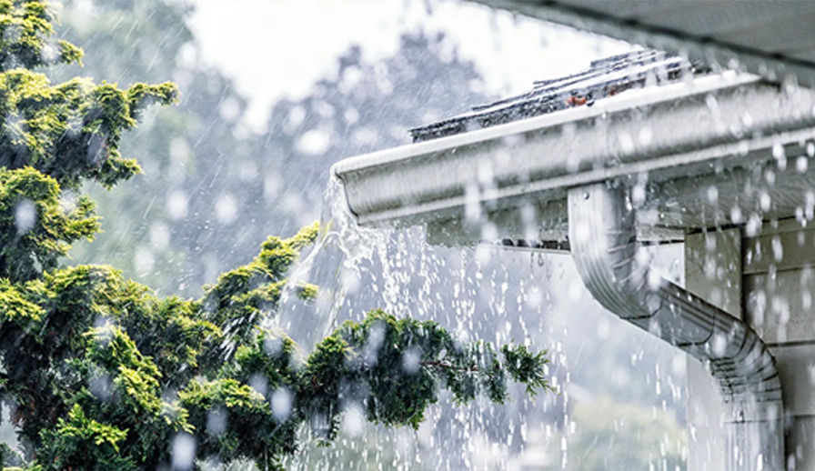 Rain pouring on a roof.