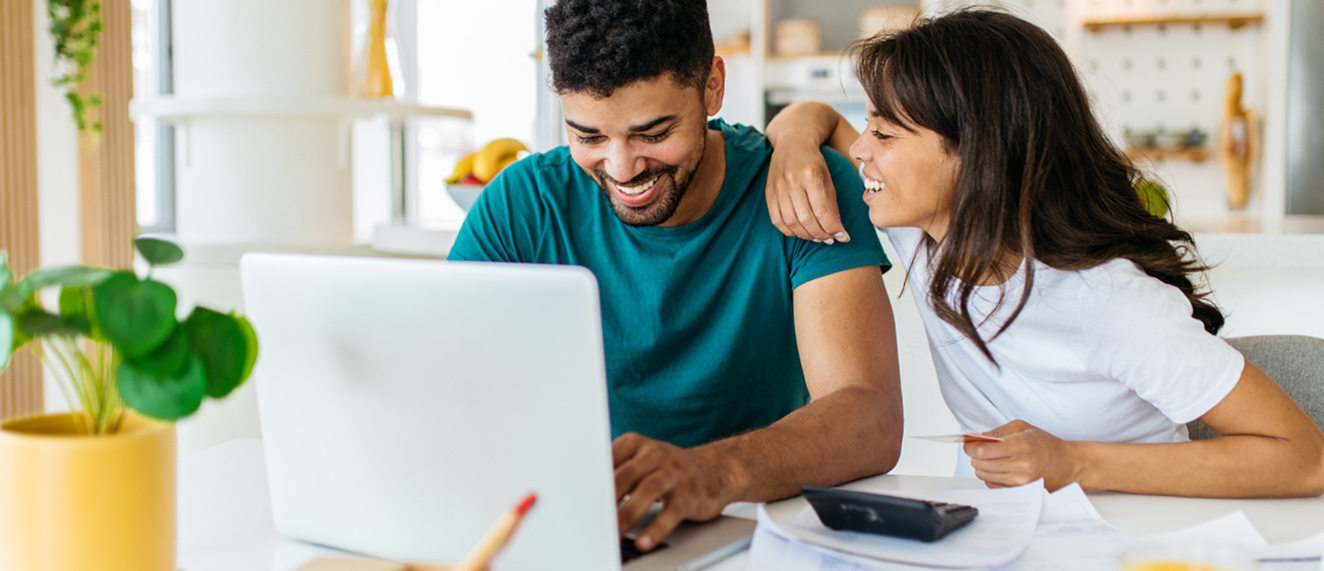 Couple looking at laptop together.