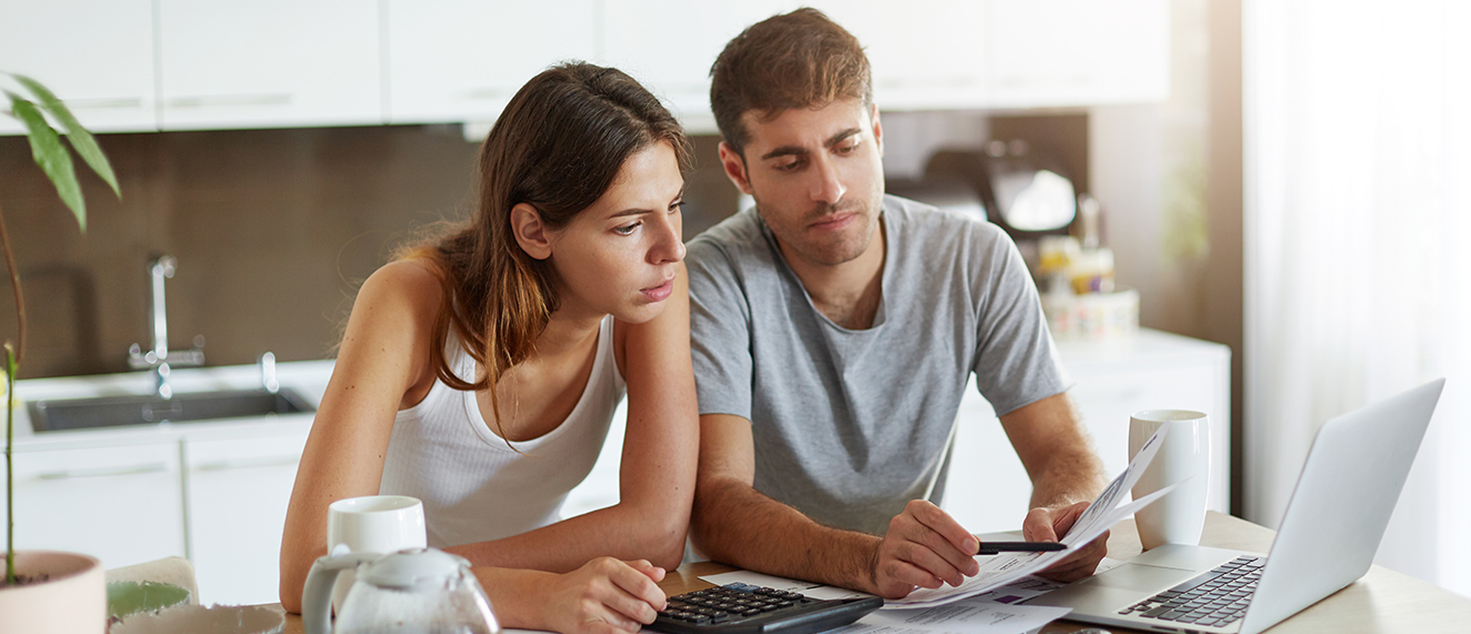 Couple looking at screen.