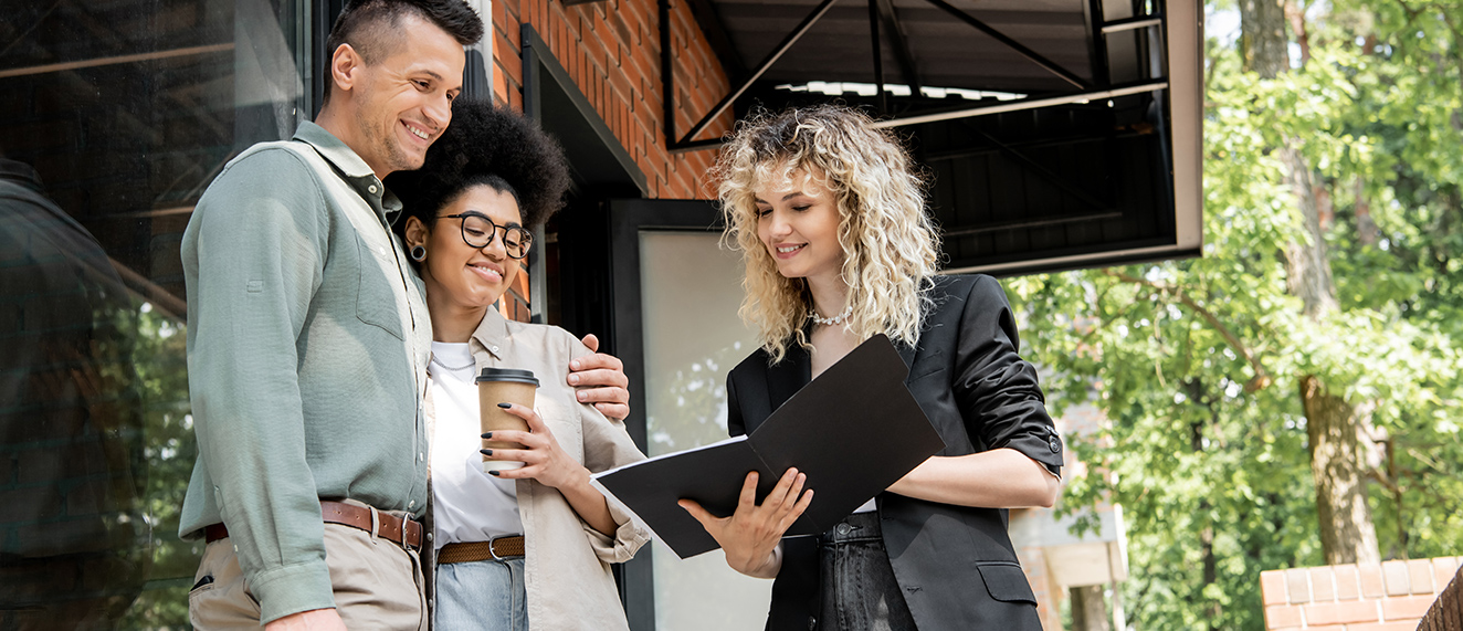 Couple speaking with REALTOR(R).