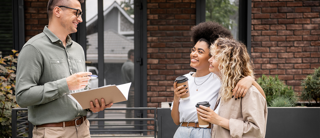 Couple speaking with REALTOR(R). 