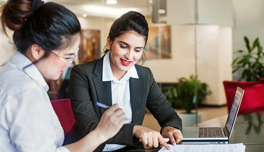 Female real estate agent with female client. 