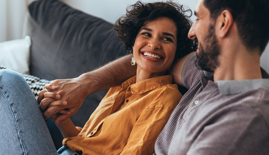 Couple sitting on a couch.