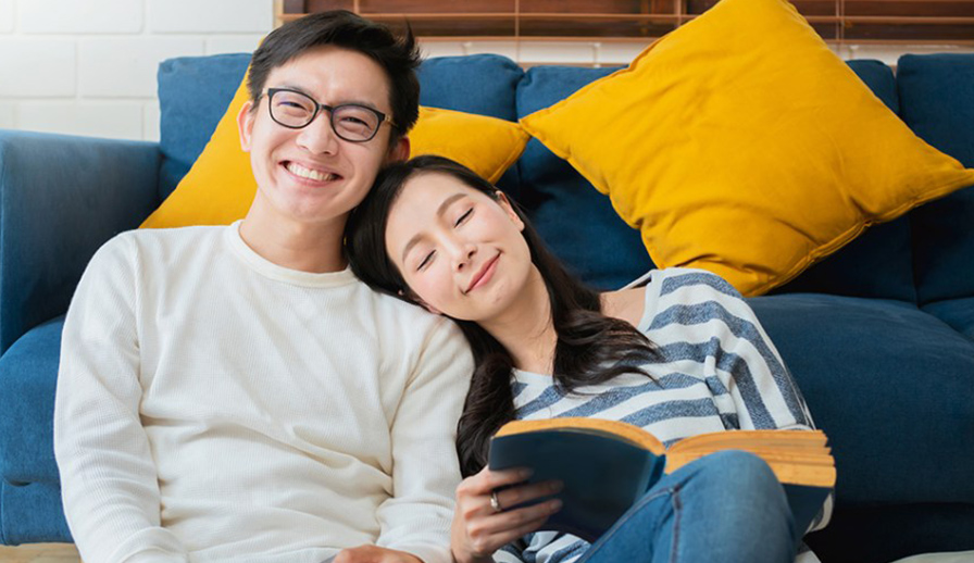 Couple sitting on a couch.