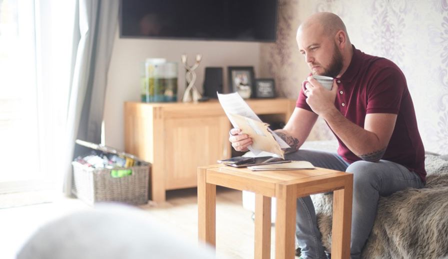 Man reading with coffee. 