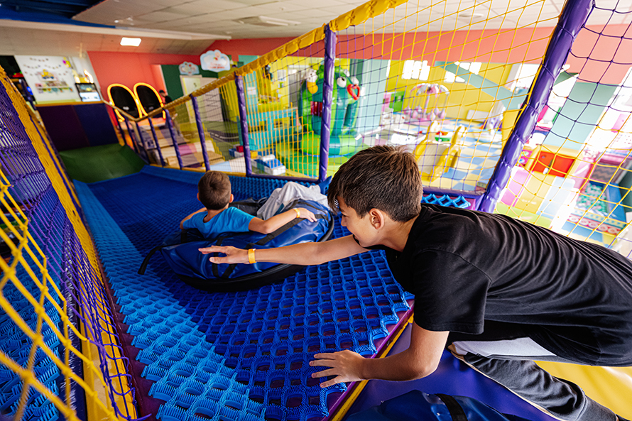 Kids in indoor jungle gym.