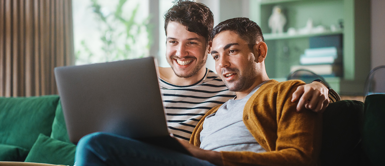 Couple looking at a laptop together.