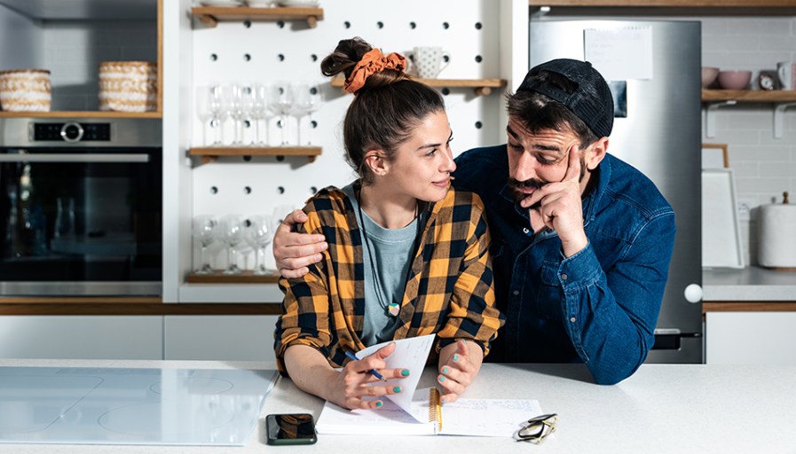 Couple sitting at a table together. 